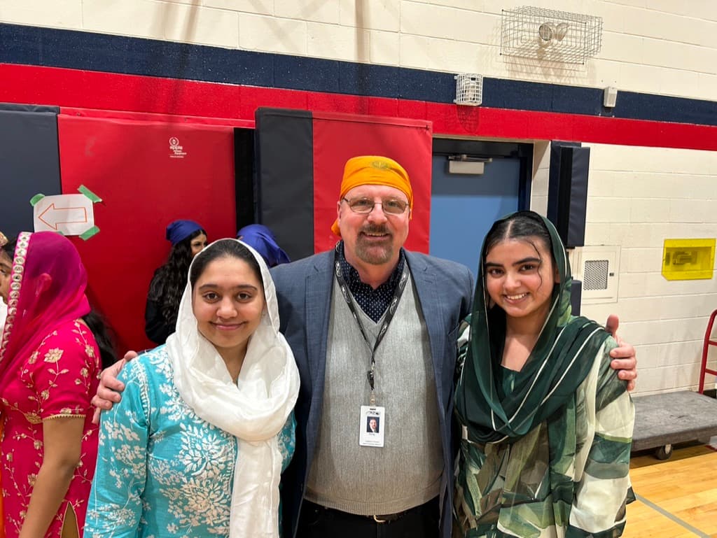 Doug Maskell with young community members at a Caledon event